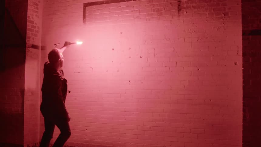 A person holding a flare