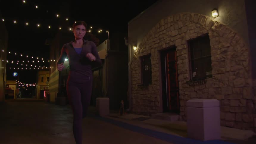 A woman running at night