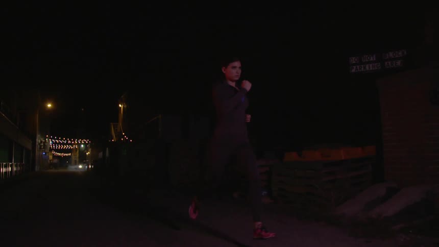 Woman is running down the street