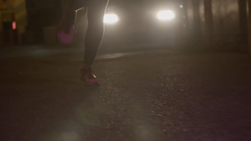 A woman is running down the street