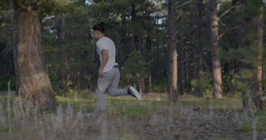 A man running in the woods
