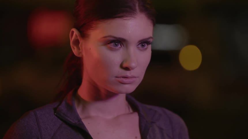 A brunette woman staring at something