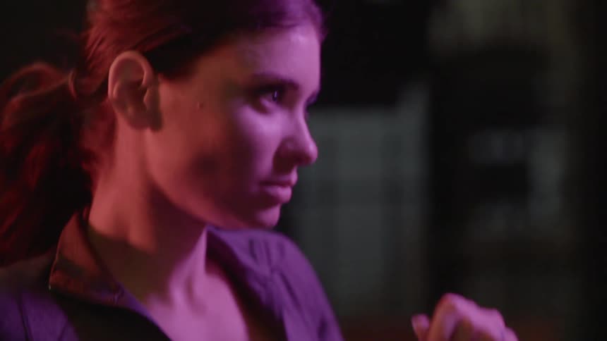 A woman running in an urban area at night