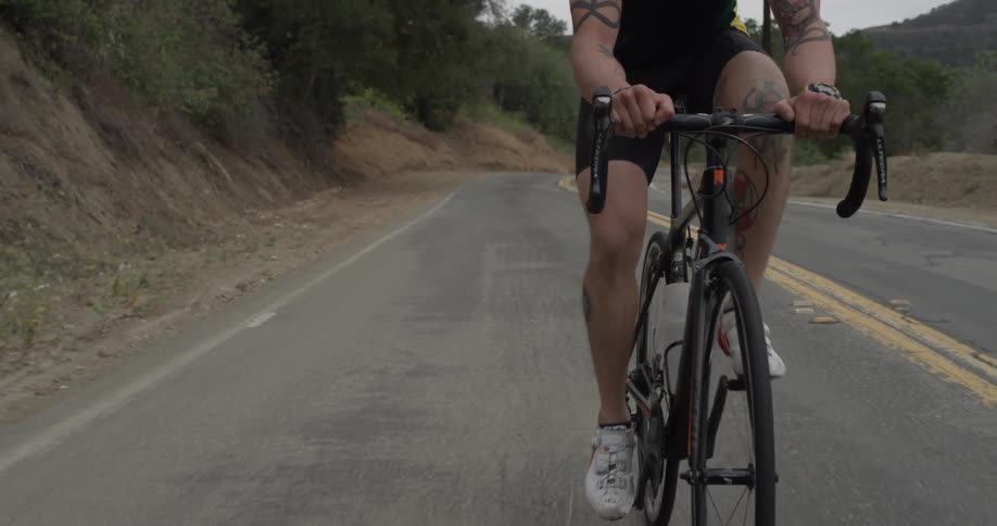 Cyclists On Hilly Roads