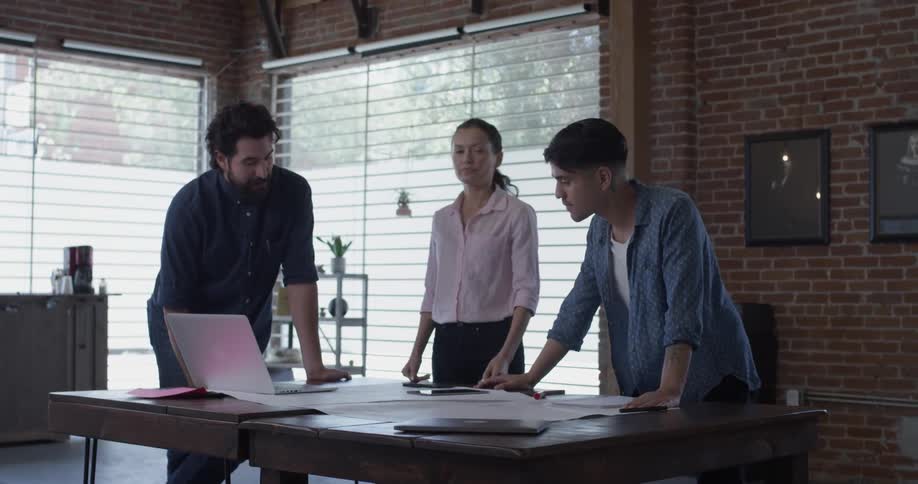 Co Workers Collaborating In Office