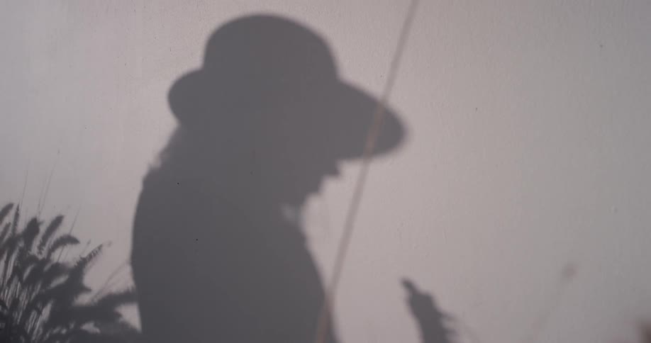 A woman's reflection is shown outside