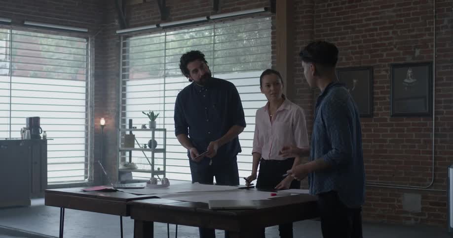 Co Workers Collaborating In Office
