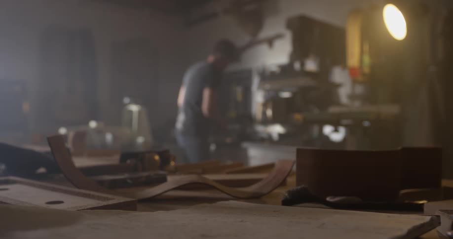 A man that is working on a project in a wood shop