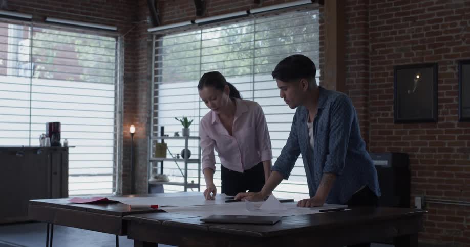 Co Workers Collaborating In Office