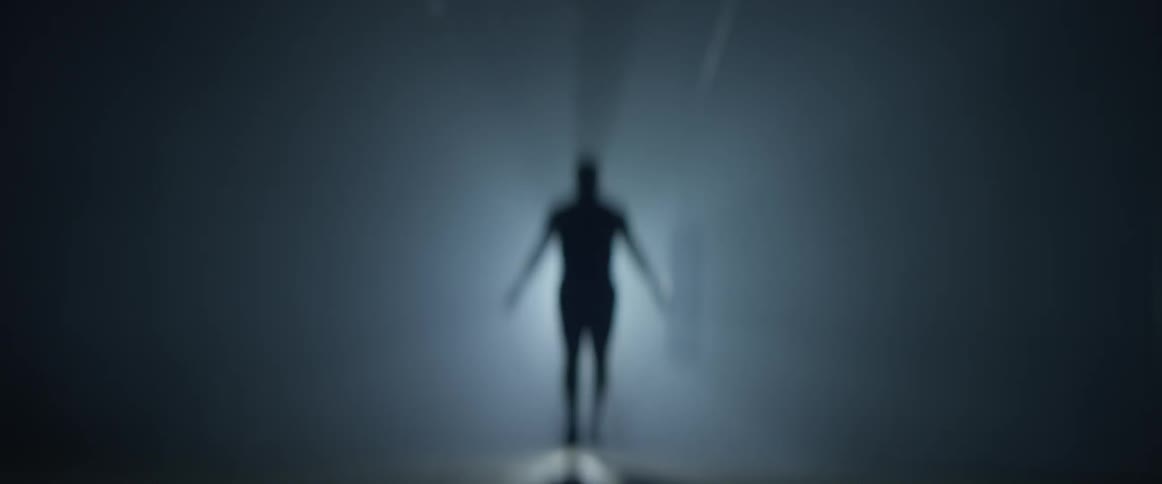 A man swinging a jump rope in a gym