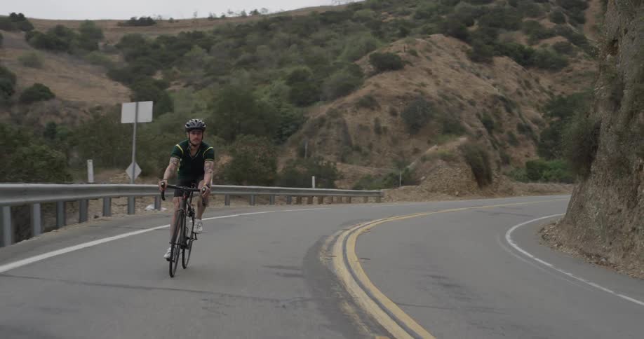 Cyclists On Hilly Roads
