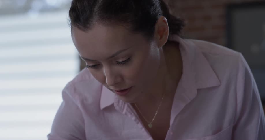 A woman is looking down inside