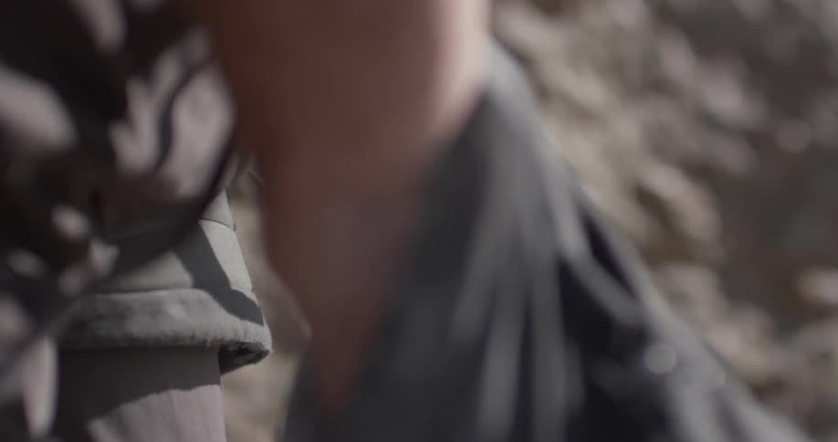 A person reaching into a bag to get chalk on their hands