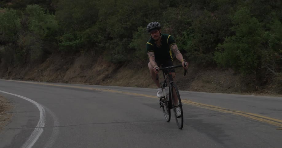 Cyclists On Hilly Roads