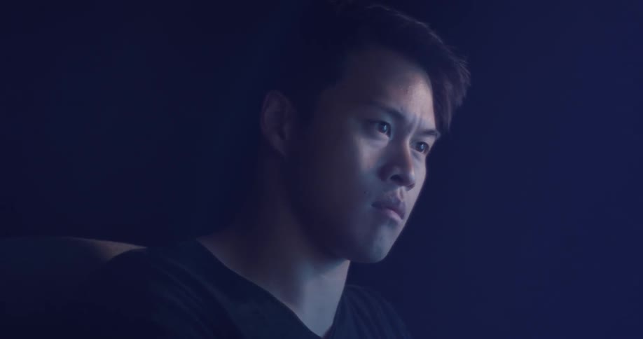 A man looking angry at a computer screen