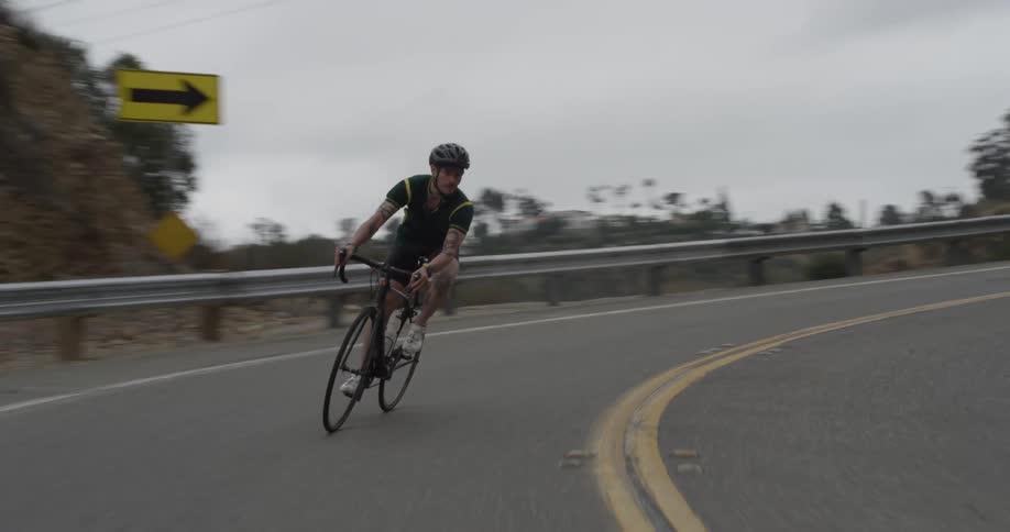Cyclists On Hilly Roads