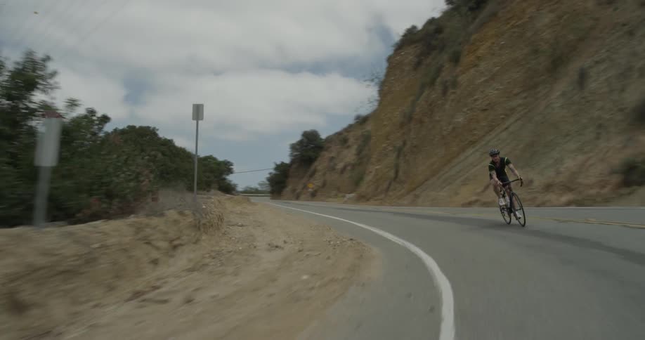 Cyclists On Hilly Roads