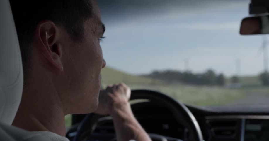 The small car bounces around as the driver watches the sunset