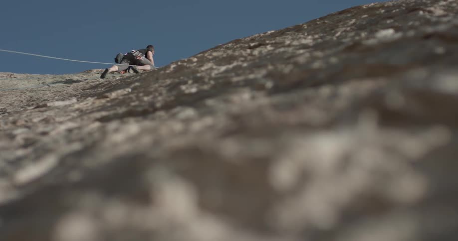 A man is climbing a mountain
