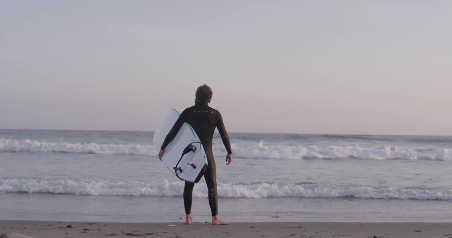 Man Driving To Beach And Surfing