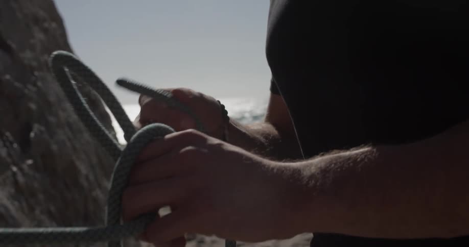 A man making a rope knot