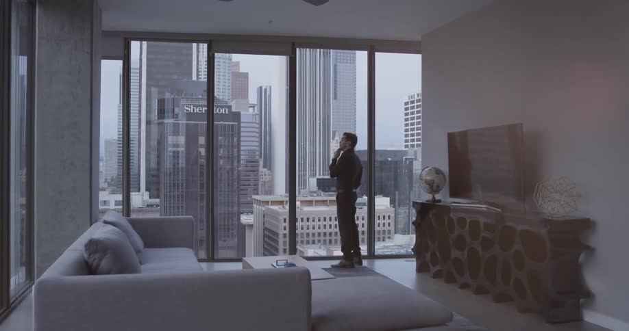 Man Inside High Rise Apartment