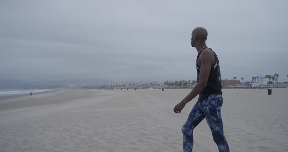 Man Meditating Outside By The Beach