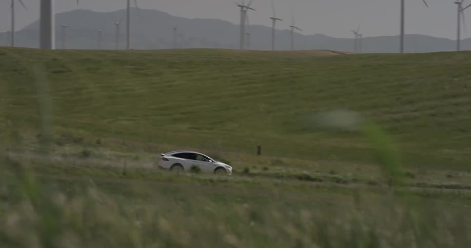 A car is driving in a remote area