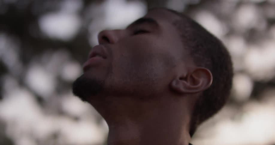 A man standing around looking up
