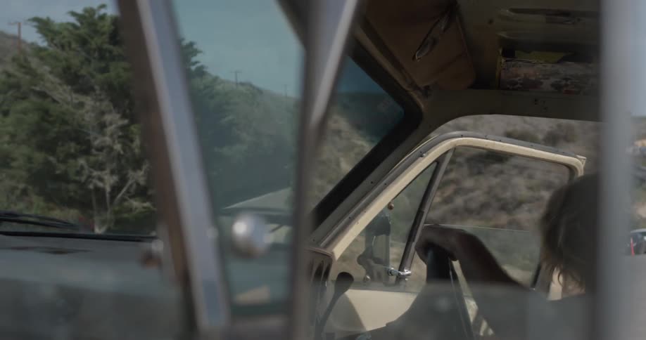 A man gets into a the driver's seat