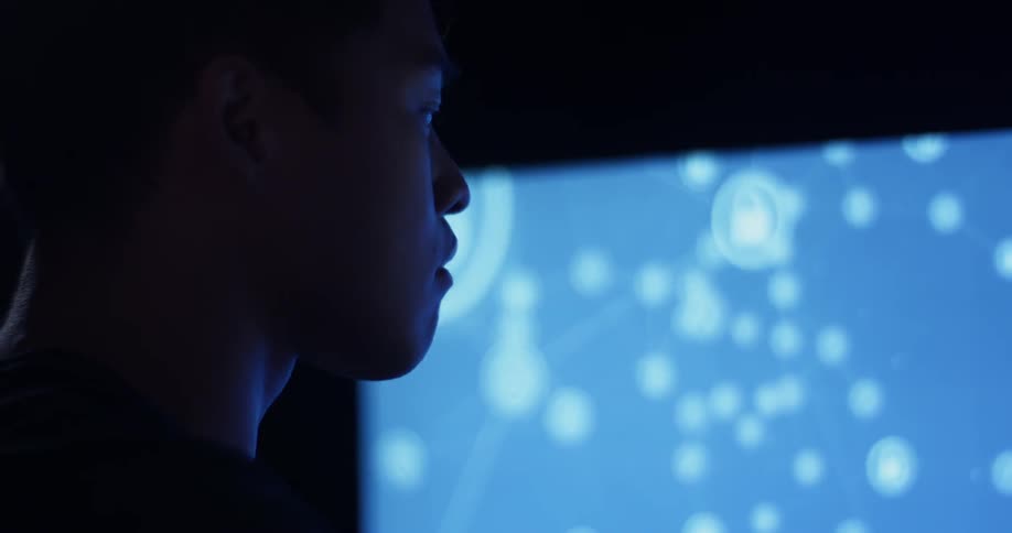 A man is looking at a computer screen