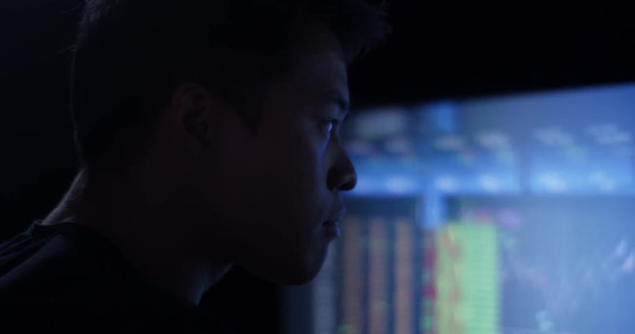 Man Coding On Computer In Dark Room