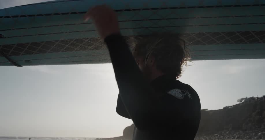 Man Driving To Beach And Surfing