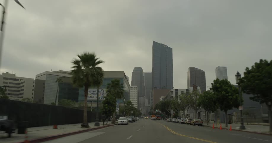 A vehicle moving fast through a city on the streets