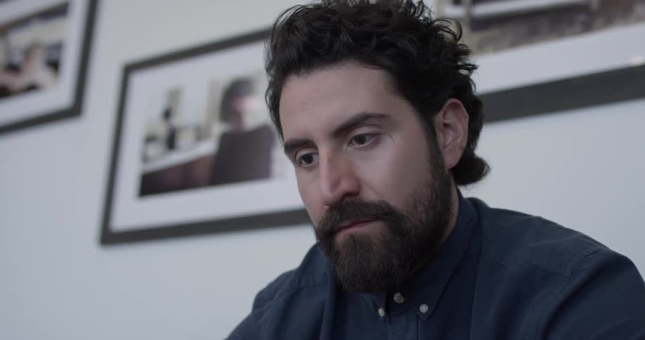 Man sits at desk typing