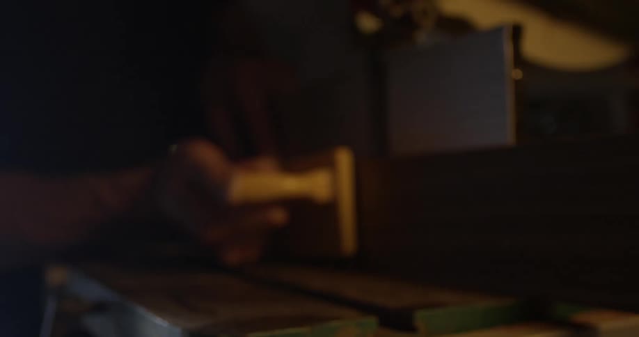 Carpenter Making Guitar In Workshop