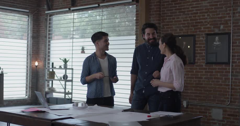 Co Workers Collaborating In Office