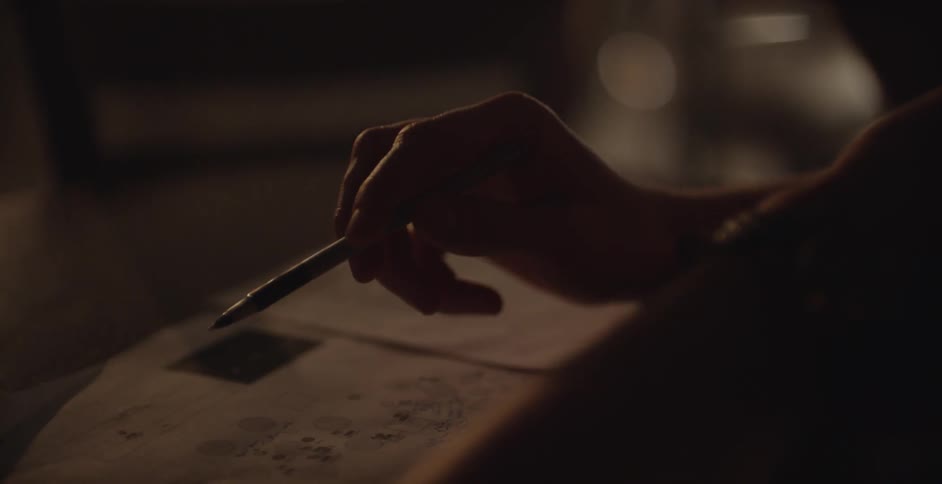 A person is writing a letter