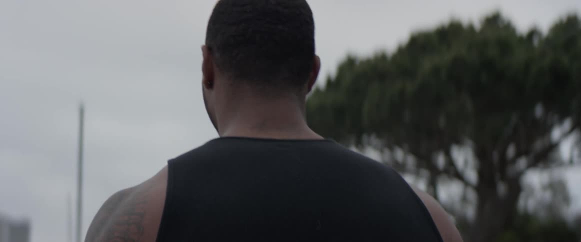 Man walks outside on a cloudy day