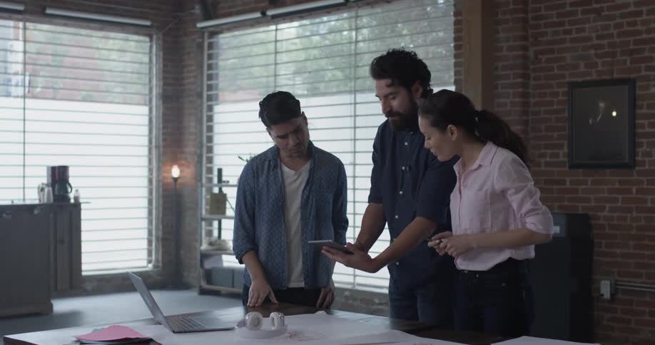 Co Workers Collaborating In Office