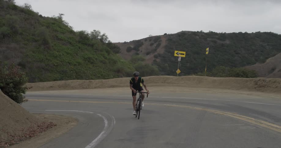 Cyclists On Hilly Roads