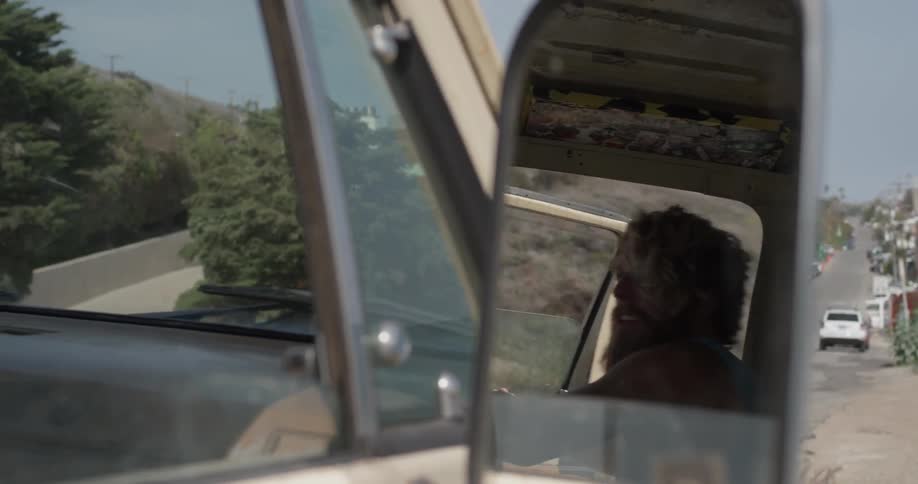 A man is getting out of a car