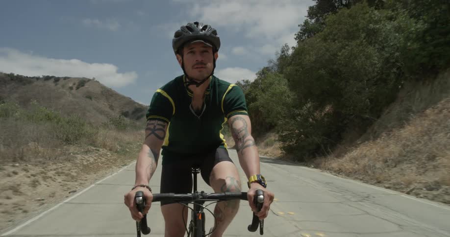 Cyclists On Hilly Roads