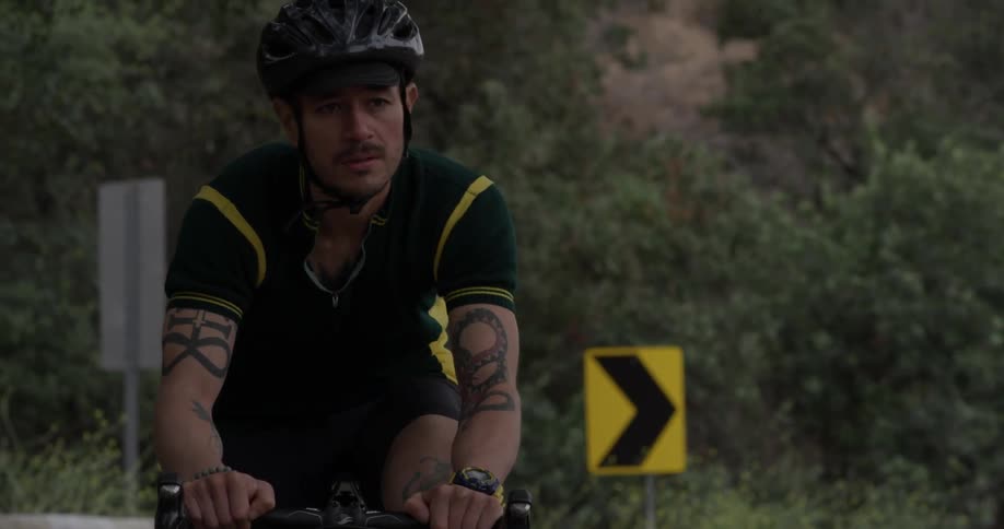 A person is riding a bicycle on the road