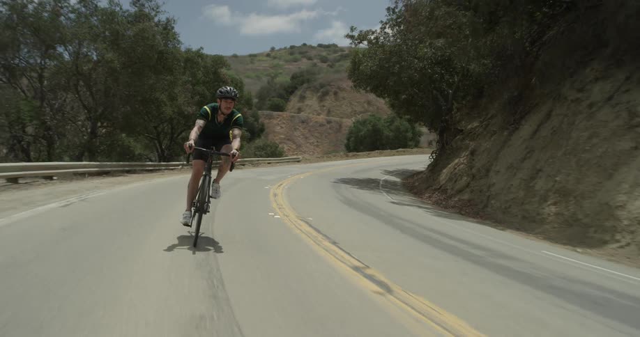 Cyclists On Hilly Roads