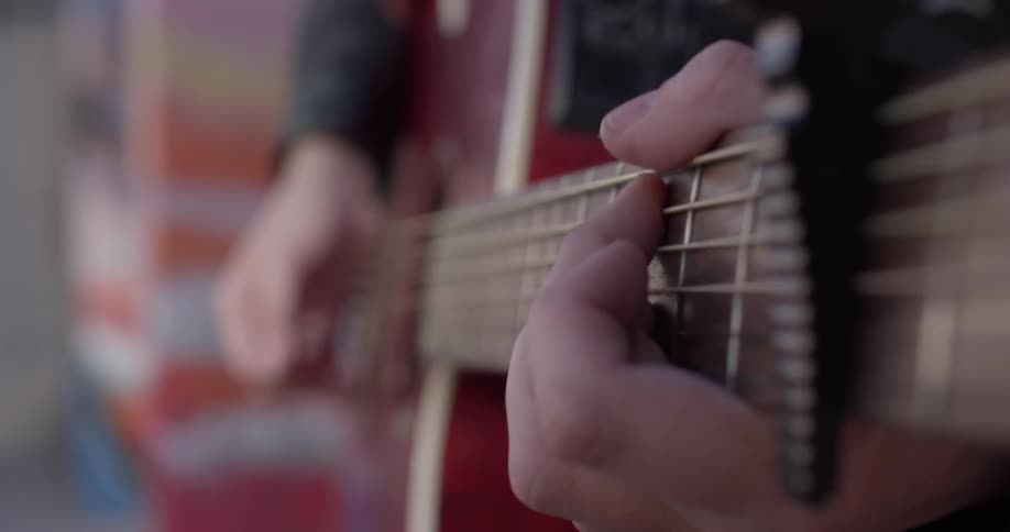 A person playing the guitar