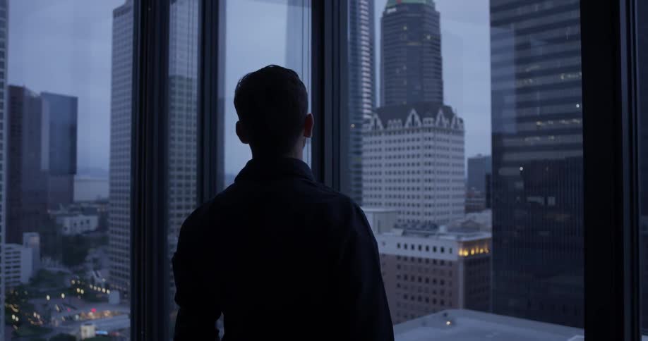 Man Inside High Rise Apartment