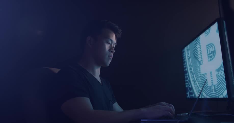 Man Coding On Computer In Dark Room