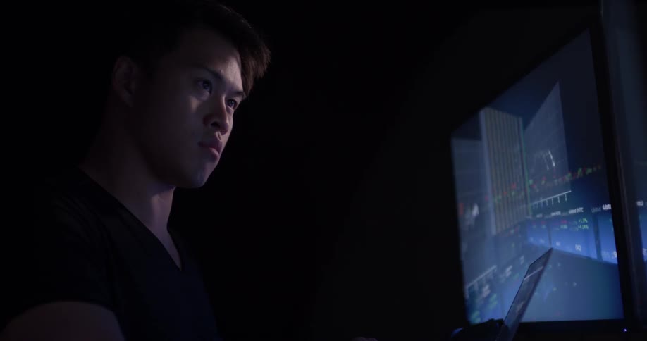 Man Coding On Computer In Dark Room