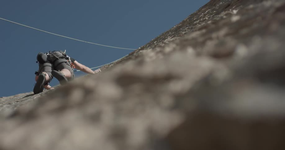 Man Climbing Wall By The Beach